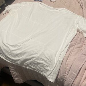 White back in action lulu lemon short sleeve tee. Like new